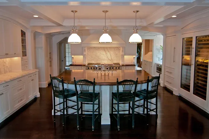Custom white kitchen island and surrounding cabinetry
